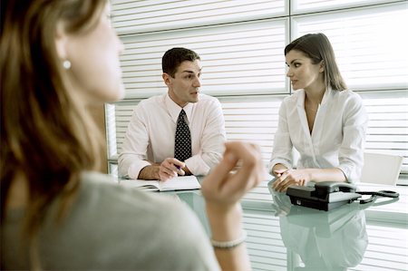 Business people interviewing professional woman Stock Photo - Premium Royalty-Free, Code: 644-02923362