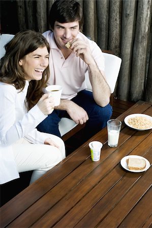 Young couple having breakfast outdoors Stock Photo - Premium Royalty-Free, Code: 644-02923507