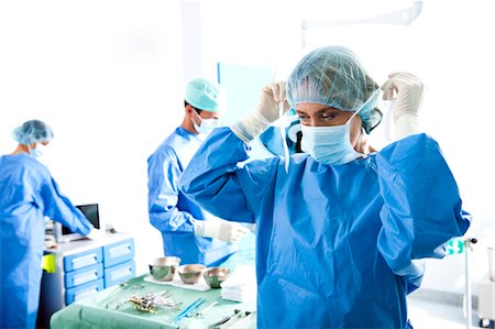 surgical mask - Medical personnel in operating room Stock Photo - Premium Royalty-Free, Code: 644-03659442