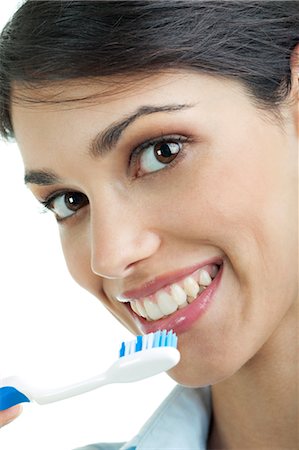 role model (female) - Young woman holding toothbrush Stock Photo - Premium Royalty-Free, Code: 644-03659636