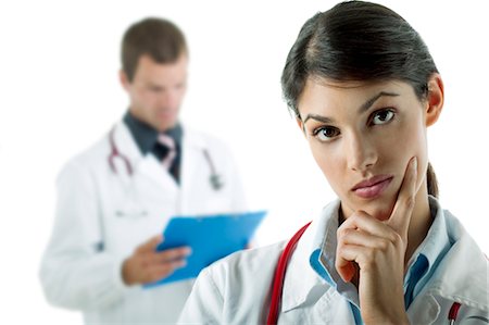 simsearch:644-03659685,k - Doctor thinking and doctor reading medical chart Stock Photo - Premium Royalty-Free, Code: 644-03659630