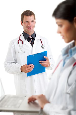 simsearch:644-03659685,k - Doctor with laptop computer and doctor with medical chart Stock Photo - Premium Royalty-Free, Code: 644-03659633