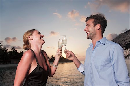 simsearch:6113-07543617,k - Couple toasting each other on dock Stock Photo - Premium Royalty-Free, Code: 649-04247571