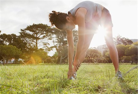 simsearch:649-04247797,k - Runner stretching in field Stock Photo - Premium Royalty-Free, Code: 649-04247797