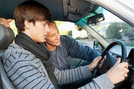 simsearch:649-05656972,k - Father teaching son to drive Stock Photo - Premium Royalty-Free, Code: 649-04827507