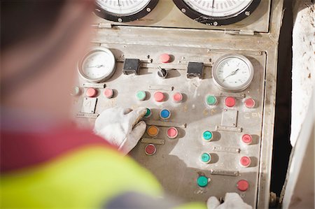 Worker at control panel of oil rig Stock Photo - Premium Royalty-Free, Code: 649-04827655