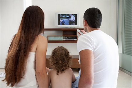 simsearch:649-06717020,k - Family watching television together Stock Photo - Premium Royalty-Free, Code: 649-04828690