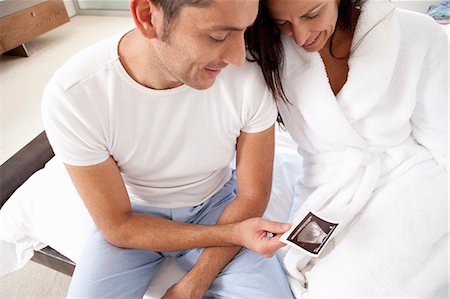 simsearch:649-05521576,k - Couple examining sonogram together Stock Photo - Premium Royalty-Free, Code: 649-04828700