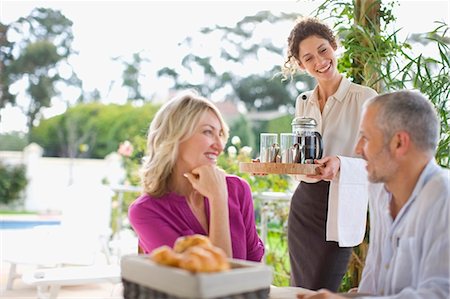 fine dining restaurant - Waitress serving coffee to couple Stock Photo - Premium Royalty-Free, Code: 649-05521122