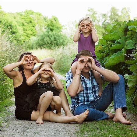 simsearch:649-06532718,k - Family making faces on dirt path Stock Photo - Premium Royalty-Free, Code: 649-05556187