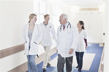 doctor nurse walking - Doctors walking together in hospital Stock Photo - Premium Royalty-Free, Code: 649-05648616