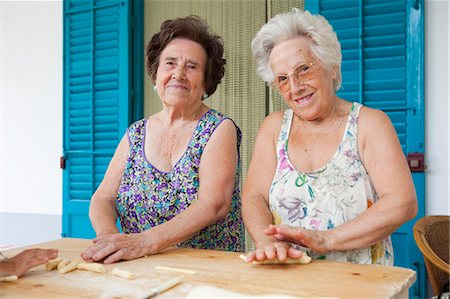 Older women making pasta together Stock Photo - Premium Royalty-Free, Code: 649-05649280