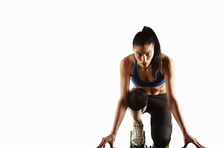starting position - Athlete crouched at starting block Stock Photo - Premium Royalty-Free, Code: 649-05656742