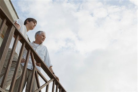 simsearch:649-05656972,k - Father and son standing on balcony Stock Photo - Premium Royalty-Free, Code: 649-05656977