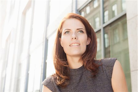 red haired businesswomen - Close up of businesswoman's smiling face Stock Photo - Premium Royalty-Free, Code: 649-05657030