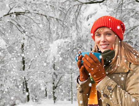 Woman drinking coffee in snow Stock Photo - Premium Royalty-Free, Code: 649-05657702