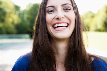 simsearch:649-05819818,k - Close up of womans smiling face Foto de stock - Sin royalties Premium, Código: 649-05800952