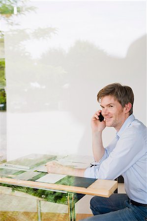 designer (interior, male) - Businessman talking on cell phone Stock Photo - Premium Royalty-Free, Code: 649-05801106