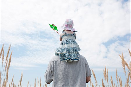 dad not mom child back - Man carrying daughter on shoulders Stock Photo - Premium Royalty-Free, Code: 649-05801230