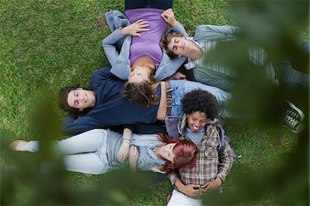 Students laying in grass on campus Stock Photo - Premium Royalty-Free, Code: 649-05801391