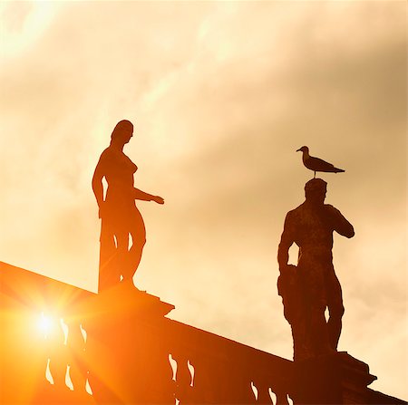 silhouettes birds - Silhouette of statues against cloudy sky Stock Photo - Premium Royalty-Free, Code: 649-05802432