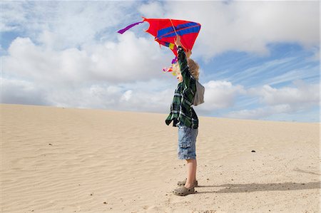 flying kite kids running - Boy flying kite on beach Stock Photo - Premium Royalty-Free, Code: 649-05820302