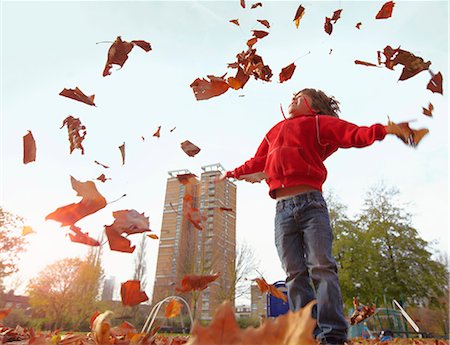 simsearch:649-06041783,k - Boy playing with autumn leaves Stock Photo - Premium Royalty-Free, Code: 649-05820457