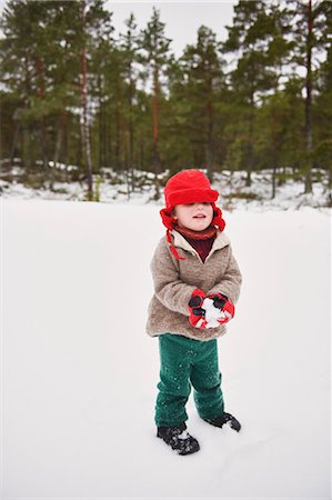 snow ball - Boy playing in snow outdoors Stock Photo - Premium Royalty-Free, Code: 649-05820485