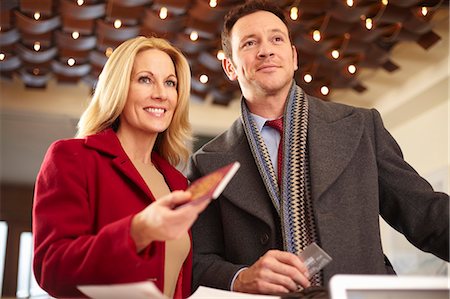 pays - Couple standing at hotel front desk Stock Photo - Premium Royalty-Free, Code: 649-05820958