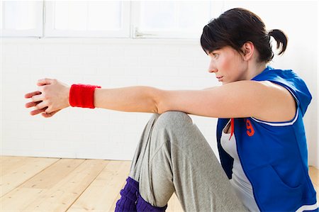 Woman sitting on floor after workout Stock Photo - Premium Royalty-Free, Code: 649-05949777