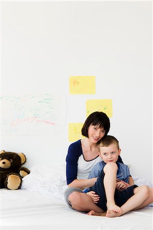 simsearch:649-05800987,k - Mother and son sitting on bed Stock Photo - Premium Royalty-Free, Code: 649-05949787