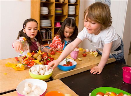 friends cooking inside - Children cooking together in kitchen Stock Photo - Premium Royalty-Free, Code: 649-05950589