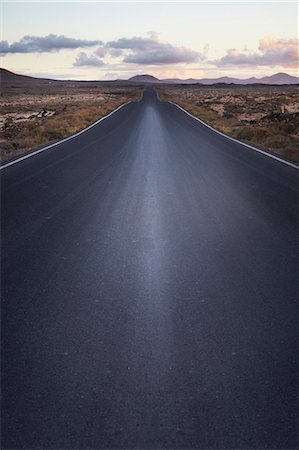 serene road - Paved road in rural landscape Stock Photo - Premium Royalty-Free, Code: 649-05950785