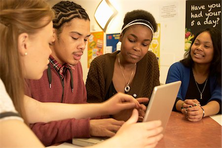 Students working together at desk Stock Photo - Premium Royalty-Free, Code: 649-05950915