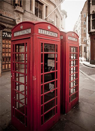 red call box - Red telephone box on city street Stock Photo - Premium Royalty-Free, Code: 649-05951137