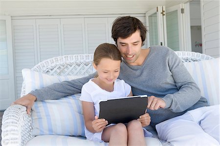 simsearch:6113-06908842,k - Father and daughter using tablet Stock Photo - Premium Royalty-Free, Code: 649-06000360