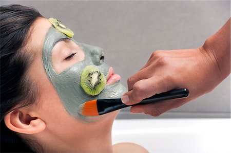 Woman having skin mask applied in bath Stock Photo - Premium Royalty-Free, Code: 649-06000634