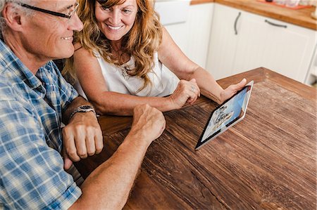 senior woman glasses - Older couple using tablet computer Stock Photo - Premium Royalty-Free, Code: 649-06000715