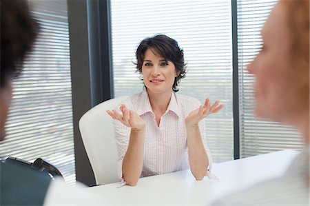 simsearch:649-06040639,k - Businesswoman talking in office Stock Photo - Premium Royalty-Free, Code: 649-06000845