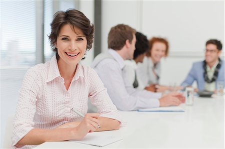 simsearch:649-06000952,k - Businesswoman making notes in meeting Stock Photo - Premium Royalty-Free, Code: 649-06000857