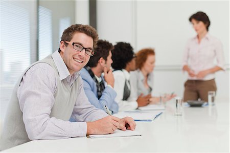 simsearch:649-06000952,k - Businessman making notes in meeting Stock Photo - Premium Royalty-Free, Code: 649-06000859