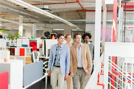 Businessmen walking together in office Stock Photo - Premium Royalty-Free, Code: 649-06000925