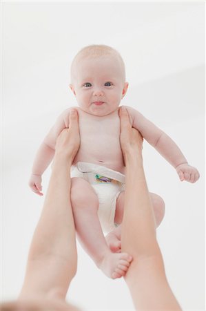 Mother lifting baby in air Stock Photo - Premium Royalty-Free, Code: 649-06001113