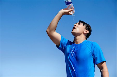 fitness man exhausting - Athlete cooling off with water outdoors Stock Photo - Premium Royalty-Free, Code: 649-06001403