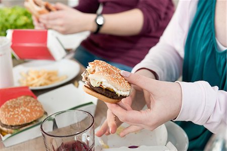 food and fast food - Couple eating fast food together Stock Photo - Premium Royalty-Free, Code: 649-06001606