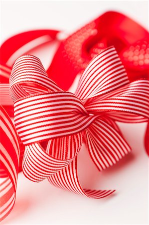 Close up of decorative red ribbons Stock Photo - Premium Royalty-Free, Code: 649-06001824