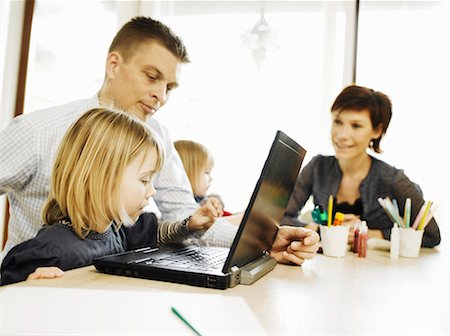 simsearch:400-05749563,k - Father and daughter using laptop Stock Photo - Premium Royalty-Free, Code: 649-06001846