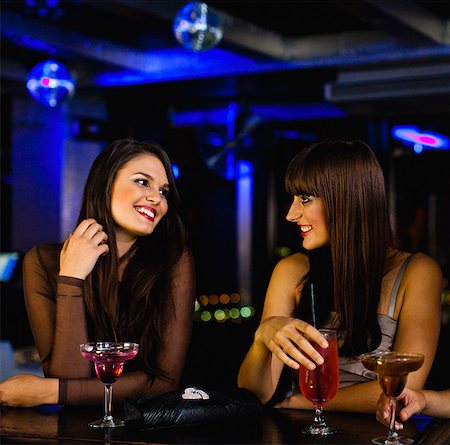 Women having drinks together at bar Stock Photo - Premium Royalty-Free, Code: 649-06040188