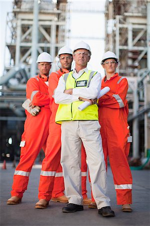 simsearch:649-06040482,k - Workers standing at oil refinery Stock Photo - Premium Royalty-Free, Code: 649-06040405