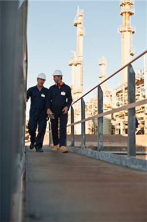 simsearch:649-06040482,k - Workers walking at oil refinery Stock Photo - Premium Royalty-Free, Code: 649-06040419